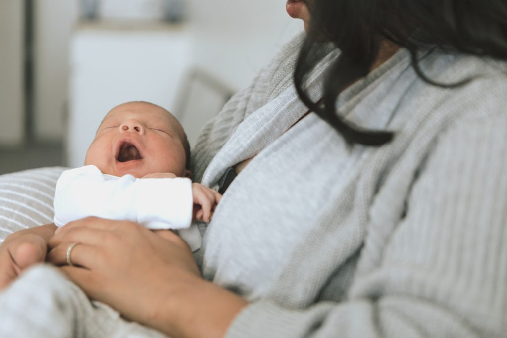 Mother holding her infant baby